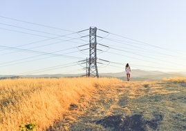 girl goes near the yellow field