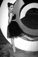 black and white photo of a ballerina in black clothes