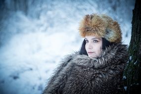 fashion model posing in winter forest