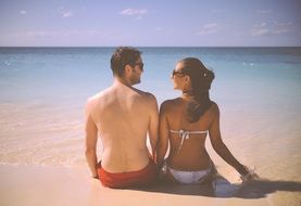 Happy couple on sand beach