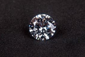 shiny diamond on a black table