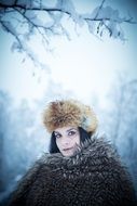 fashionable girl on the winter background