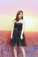 photo of an asian girl in a black dress