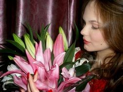 Girl smelling a flowers