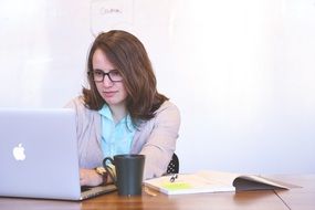 young woman working at laptop