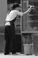 Grey photo of window cleaner girl