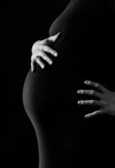 Photo of pregnant woman in a dark