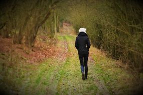 young woman on the forest path