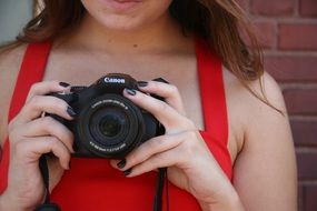 girl in red with camera