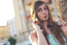 girl posing with sunglasses
