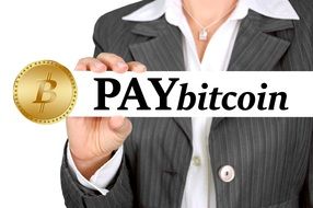 a woman with a sign in his hands paybitcoin