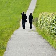 Photo of pair is walking on a way