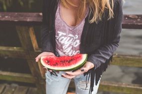 girl is eating a watermelon