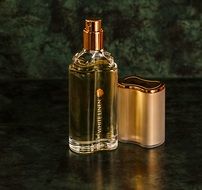 Golden bottle with the parfume
