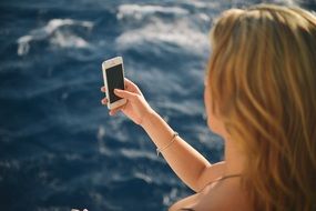 Woman making photo smartphone