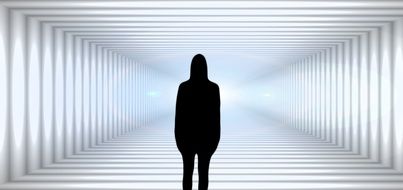 silhouette of woman looking into tunnel