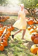 young woman and pumpkins