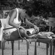 young woman reading in jardin du luxembourg