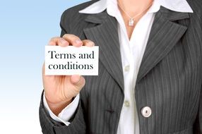 Woman holding Terms and conditions card