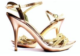 gold sandals on a white background