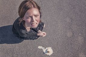 fallen down ice cream on asphalt