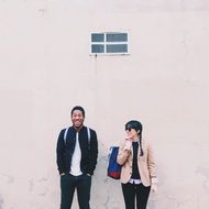couple stand near the wall