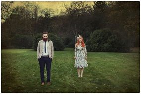 Pair of man and woman are on a field