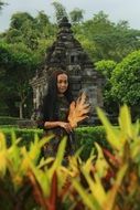 Portrait of girl in park near the temple