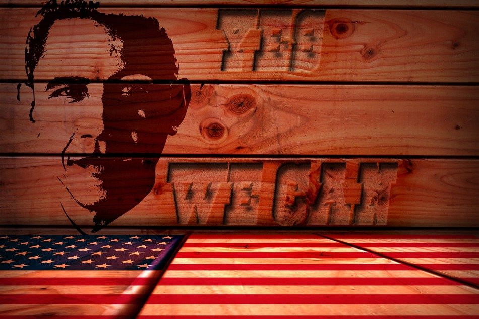 obama’s face on wooden boards on background