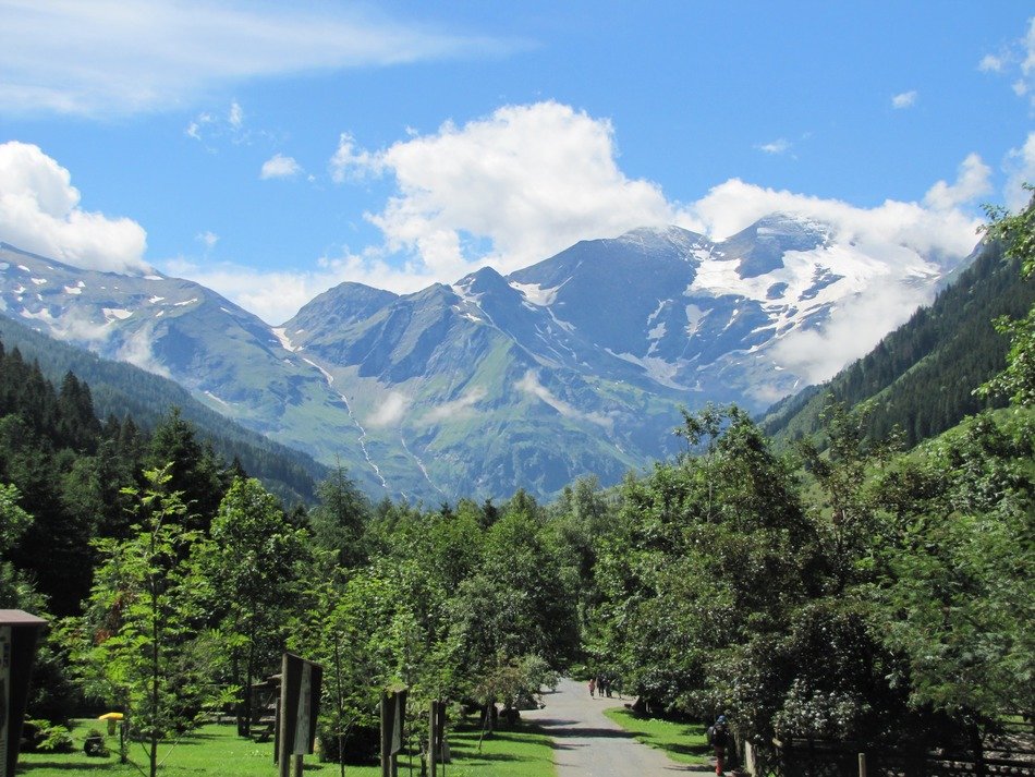 austria mountains sky blue clouds