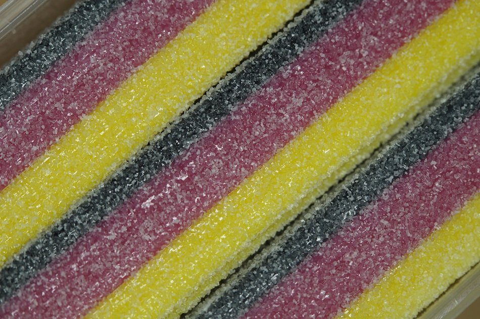 black red gold sweet candy as background