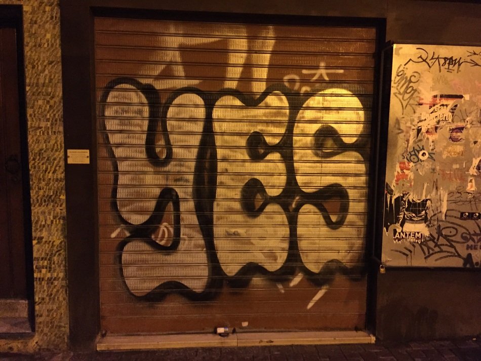 Graffiti on a brown background with the word yes