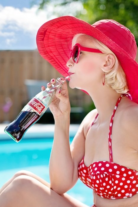 woman in red by the pool