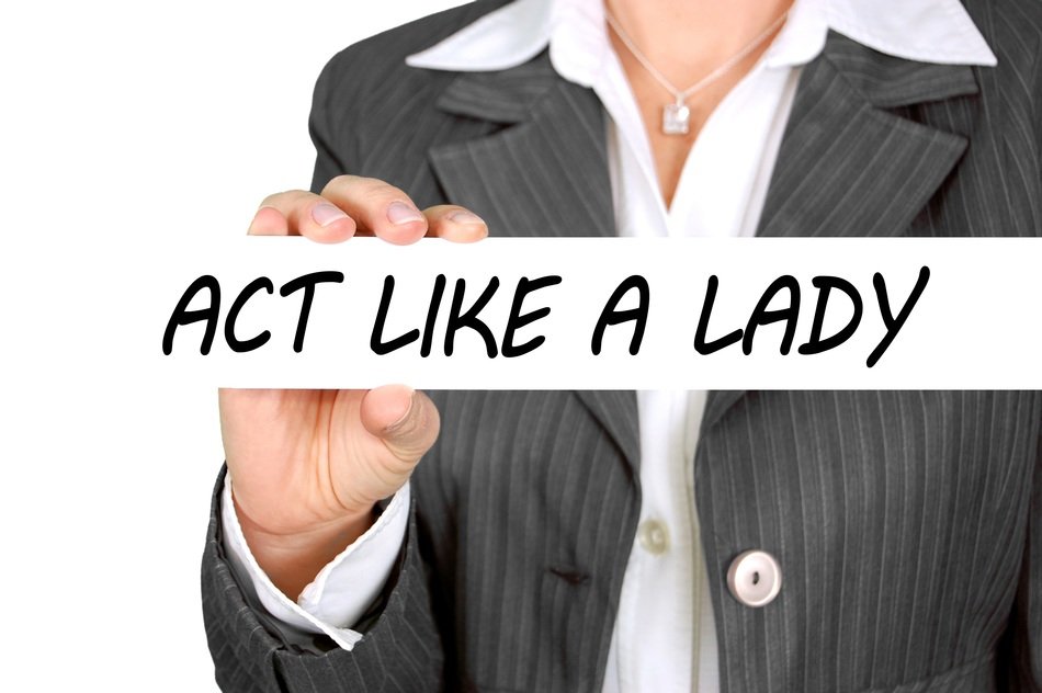 the inscription act like a lady in female hands