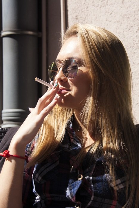 Photo of blonde girl in smoking
