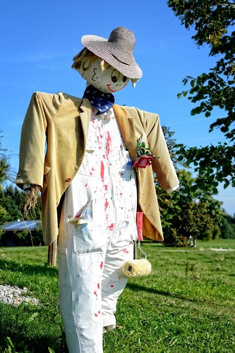 Scarecrow woman made of straw in a jacket