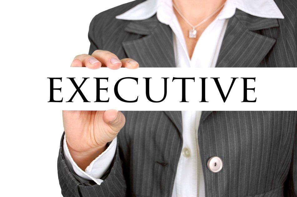 a woman with a sign in the hands of the executive