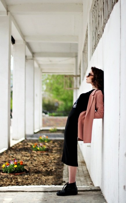 girl posing near the wall on the street