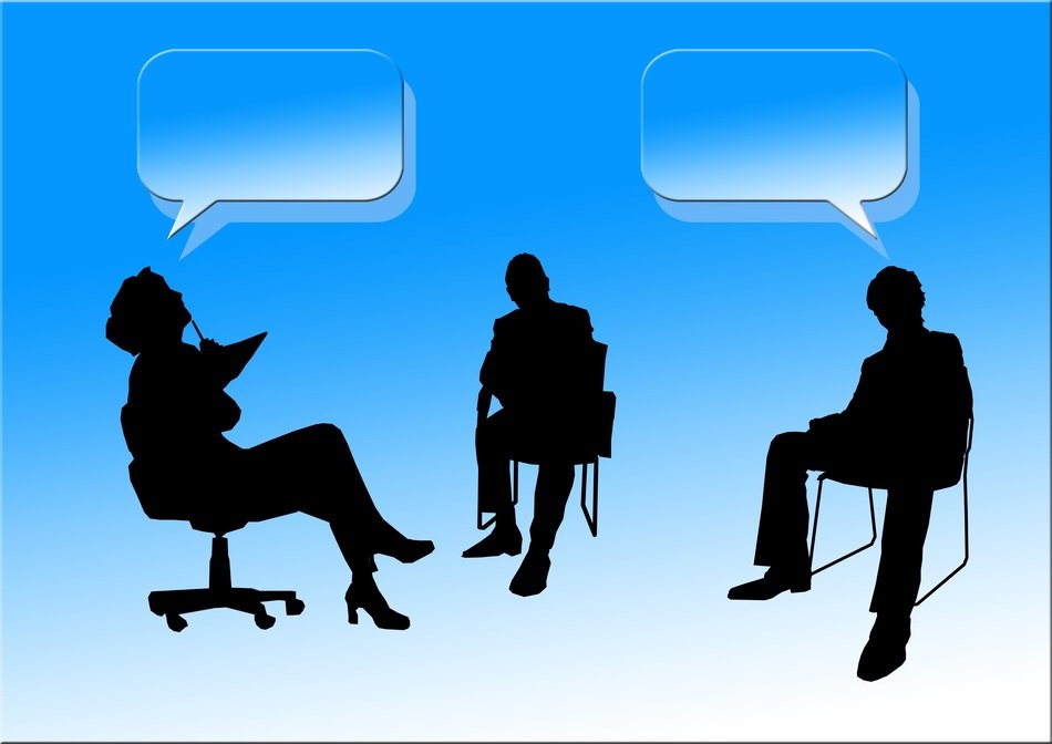 silhouettes of business people discussing ideas