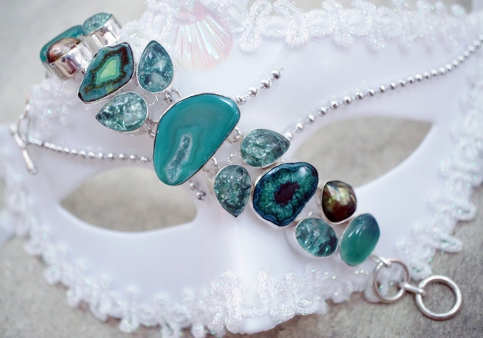 bracelet with blue stones and white mask