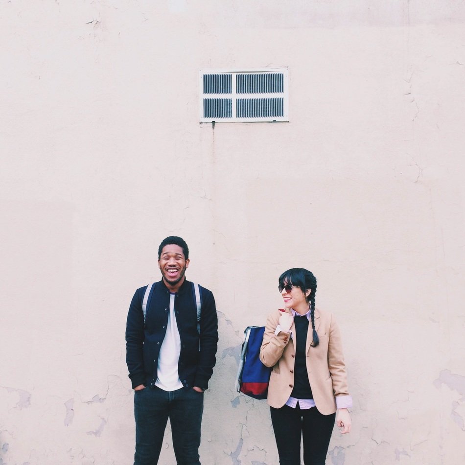 couple stand near the wall