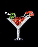 glass with red berries on a black background