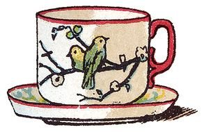 cup with a pattern of birds on a saucer