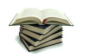 open book on a stack of books