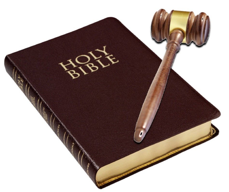 photo of bible and wooden hammer