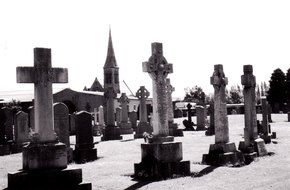 Black and white photo of gravestones