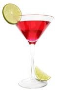red cocktail in a glass with green lime