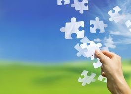 man arranges puzzles in the picture