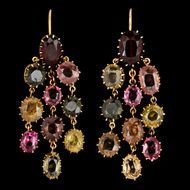 pair of luxury earrings with colorful gems