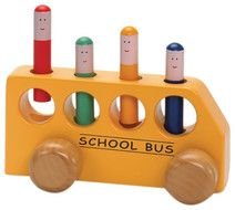 Kid Playing With Toy School Bus
